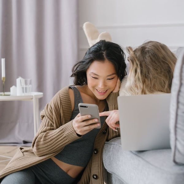 Person stretching gently in a comfortable living room setting.